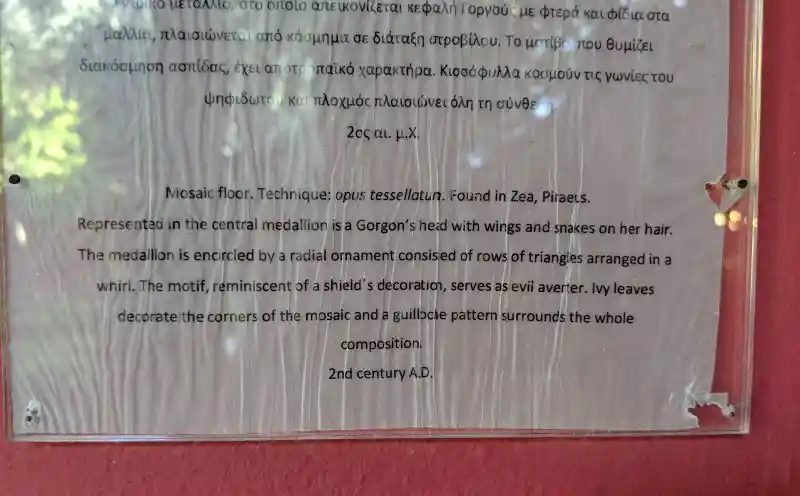 Mosaic floor from Piraeus with a Gorgon medallion and radial patterns.